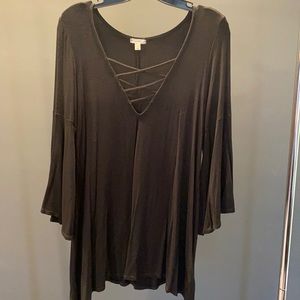 Black top with crisscross v-neck and bell sleeves. Size M.